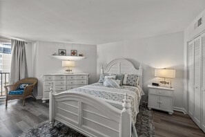 Clean lines, cozy comfort—this white bedroom offers a modern, relaxing vibe