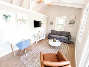 Living Room adjacent to the dining room and kitchen with Queen size sleeper sofa