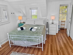 Queen size bed leading to bathroom