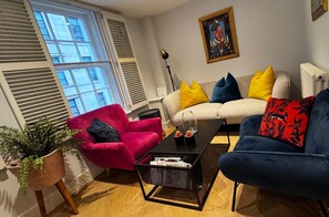 Bright living room with plenty of seating and space for a comfortable stay 