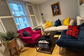 Bright living room with plenty of seating and space for a comfortable stay