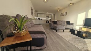 Bright and spacious living room with 2 sofa beds, coffee table and TV with SKY connection and Netflix