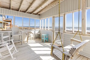 Enjoy the screened-in back porch overlooking the ocean