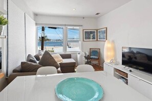 Views of Mission Bay from your apartment. Stylish furniture give this apartment the ultimate beach vibe. 
