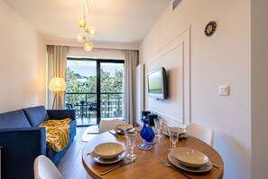 living room with dining area and TV