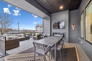 Patio: A mix of modern outdoor furniture and cozy textiles makes this space ideal for relaxing and entertaining.