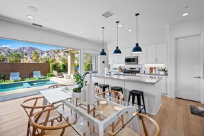 Open Kitchen – Modern space with pool views.