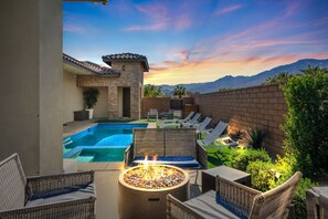 Fire Pit Lounge – Cozy seating with mountain views.