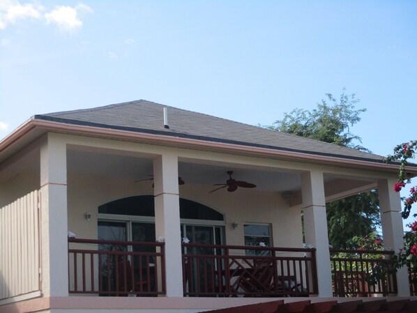 Large sea facing covered deck for relaxing & enjoying meals & drinks.