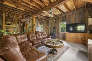 Large leather sectional on second floor includes recliners.