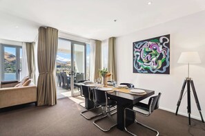 A lovely dining room which flows seamlessly out to the huge rooftop outdoor deck.  