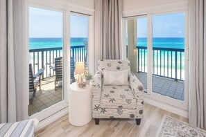 Your perfect morning spot—sip coffee or dive into a good book while soaking in peaceful Gulf views from this cozy corner of the living room