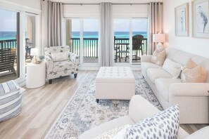 Spacious living room with natural light and coastal charm