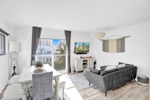 Living room. Close the shades and linen curtains for additional privacy!
