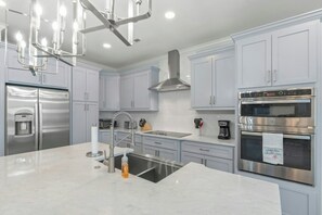 A chef's dream kitchen, fully stocked and loaded.