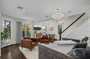 Bright and inviting living area with modern decor and ample seating.