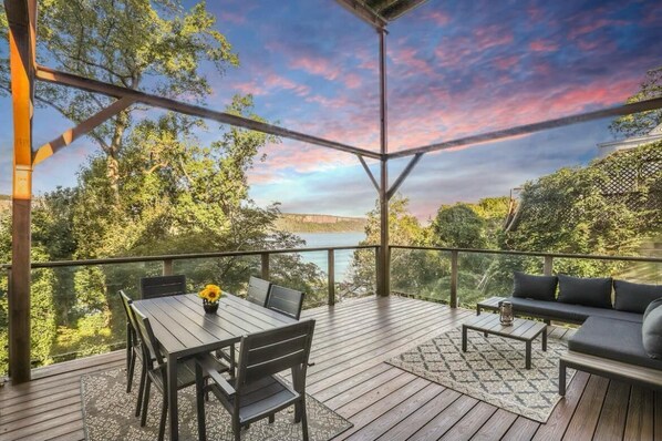 Relax and enjoy the sunset from this beautifully furnished outdoor space.