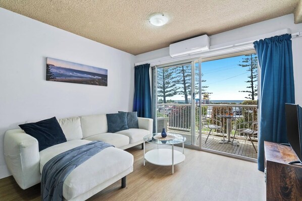 Immerse yourself in the cool comfort of air conditioning as you sink into the L-shaped sofa, catch up on your favourite TV shows, or get lost in a good book.
