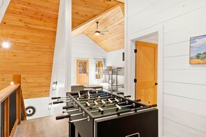 Elevate your stay! Our upper loft offers the perfect spot for relaxation and play.