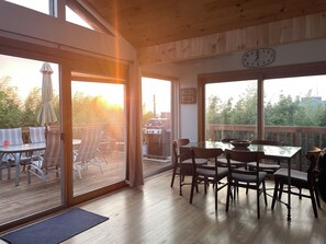 Views of sunset over the bay from living and dining room.