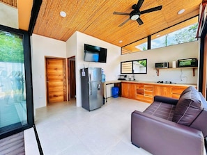 Equipped kitchen and mini living room with TV