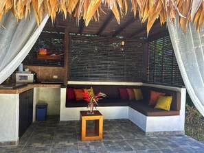 Small external kitchen and living area facing the pool