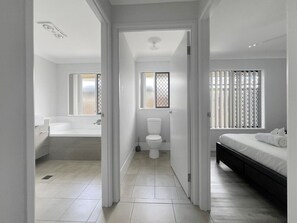 Bedroom #2 with it's own bathroom and bath tub.