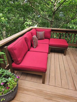 Cushioned seating area on the sun porch.