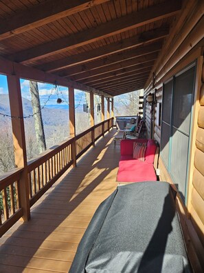 Huge covered front porch offers a hot tub, gas grill, gas fireplace and VIEWS!