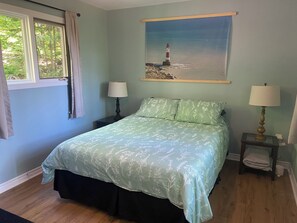 Queen Bed with light duvet and comfy pillows