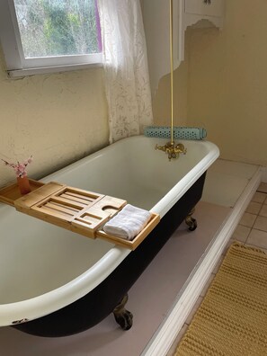 Over-sized soaking tub off of master bedroom.
