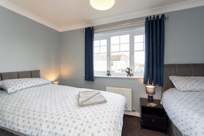 Two single beds overlooking front of the property