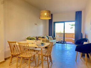 Bright and comfortable living-dining room with direct access to the terrace, perfect to enjoy a relaxed stay and easily connect the interior spaces with the exterior.