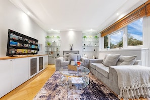 Relax in the modern, open-plan living space with ample seating for all.