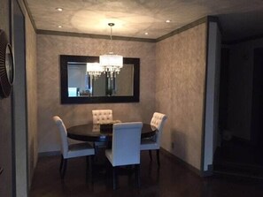 Spacious dining area with beautiful chandelier lighting