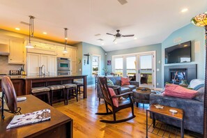 Second floor main living area with slider to balcony deck