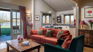 Relax on the sofa and look out over the lake beyond