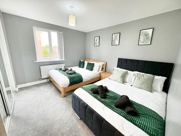 Spacious and stylish, this room features two comfortable double beds, modern decor, and a cozy ambiance perfect for relaxation or sharing with friends.