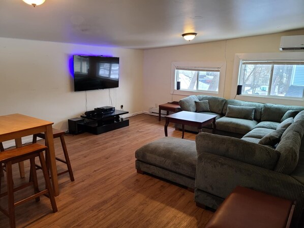 NEW LISTINGS - Large sectional in living room with SmartTV