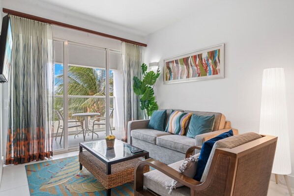 - Relax in this bright and stylish living area, perfect for unwinding after a day of adventure - Step onto your private balcony to soak in the fresh air and scenic views - Cozy seating, vibrant decor, and a welcoming vibe make this the ideal retreat