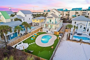 Tidepool - 100 yards to the beach and FREE golf cart included! Private backyard oasis with heated pool, putt-putt, lounge chairs, hammock, outdoor kitchen, fire pit, and corn hole.