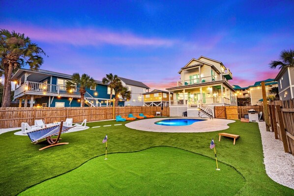 Tidepool - 100 yards to the beach and FREE golf cart included! Private backyard oasis with heated pool, putt-putt, lounge chairs, hammock, outdoor kitchen, fire pit, and corn hole.