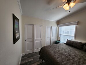 Bedroom Retreat: Bright and airy room with a plush bed and charming decor awaits your relaxation!
