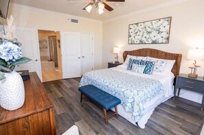 Master bedroom w/ ensuite bathroom and sliding door access to the patio