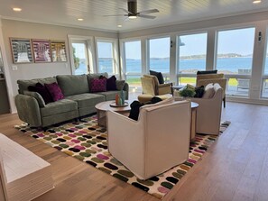 The living area has lots of comfortable seating to enjoy the gorgeous view 