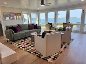 The living area has lots of comfortable seating to enjoy the gorgeous view
