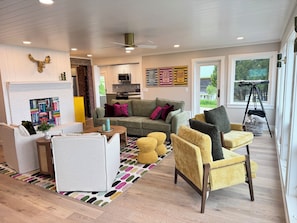 The spacious living room is open to the kitchen, dining area and 1st floor rooms