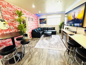 Main level living area has 70-in smart TV, Sonos speaker, Govee lights and more!