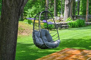 Enjoy a good read outside in this comfortable chair!