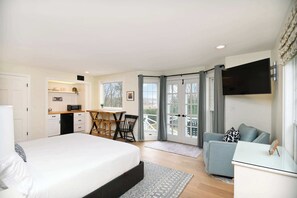 Harbor View’s breezy studio boasts a plush king bed, ensuite, TV, & cozy kitchenette